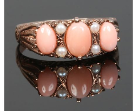 A 9ct gold coral and pearl dress ring, size S.