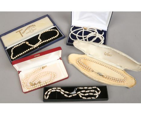 Five cased simulated pearl necklaces.