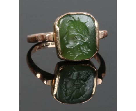 A George V 9ct gold green hardstone intaglio ring, assayed Birmingham 1915, size M.