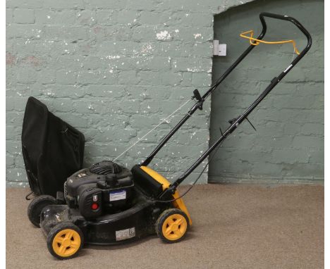 A Mccullock M40-450c petrol driven lawn mower, housing a Briggs & Stratton engine with grass box.