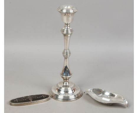 A large weighted silver table candlestick assayed Birmingham 1986, a silver and tortoise shell oval cover Birmingham 1919 and