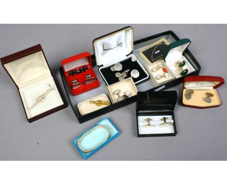A collection of mens cufflinks, tie clips etc.
