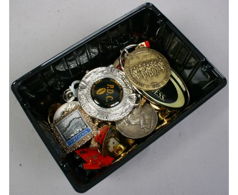 A collection of enamel badges and medals etc.