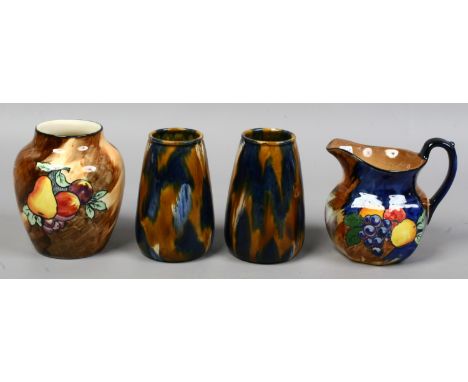 A H & K vase and jug both decorated with fruit, along with a pair of G. H. Richards vases.