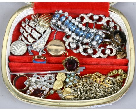 A jewellery case and vintage costume jewellery including white paste, enamelled ring and a cocktail ring.