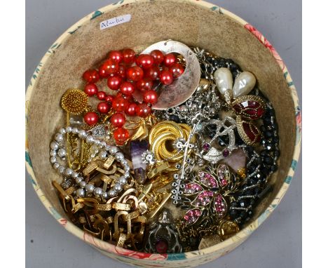 A box of vintage costume jewellery.