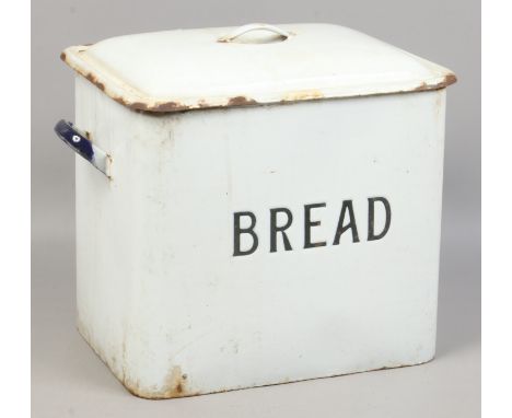 A vintage white enamel bread bin.