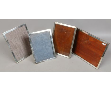 Four silver mounted eizel photograph frames, two with engraved decoration. Assayed Birmingham 1916, 1929, 1931 and 1934. Land