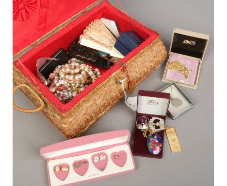 A basket jewellery box and contents of costume jewellery and compacts.