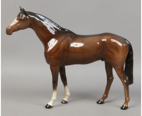 A Beswick ceramic figure of a bay horse.