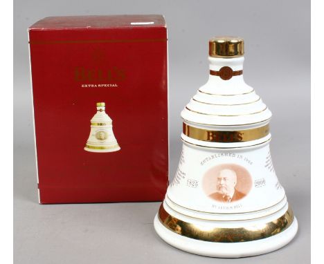 A Bells commemorative Christmas edition Whisky decanter full and sealed with extra special old Scotch Whisky in original box.