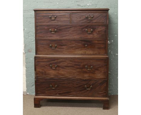 A George III mahogany chest on chest raised on bracket supports.