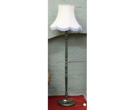 A turned green painted standard lamp.