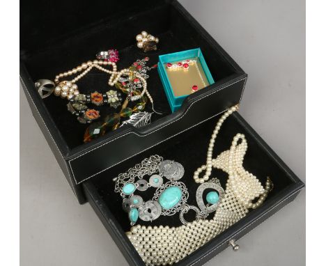 A black leatherette jewellery box and contents of costume jewellery.