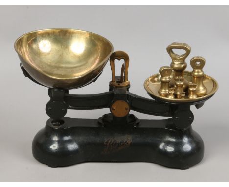 A set of Boots cast iron and brass kitchen scales.
