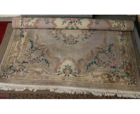 A large Chinese mixed ground wool carpet with floral decoration, 385 x 278cm.