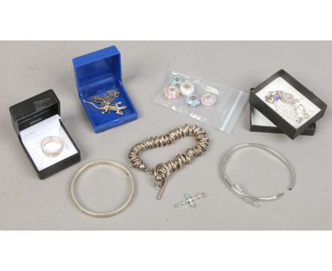 A collection of silver jewellery to include pendants, ring, bangle etc.