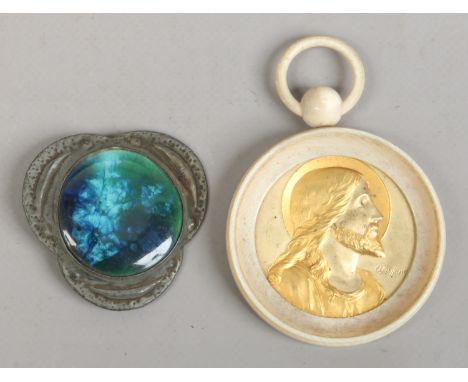 After Ruskin, an Arts and Craft trefoil pewter brooch, along with O. Ruffony gilt portrait of Christ in ivory frame.