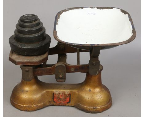 A set of Parsons weighing scales with weights.
