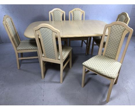 Pale wood extending dining table with six chairs, table approx. 117cm x 89cm