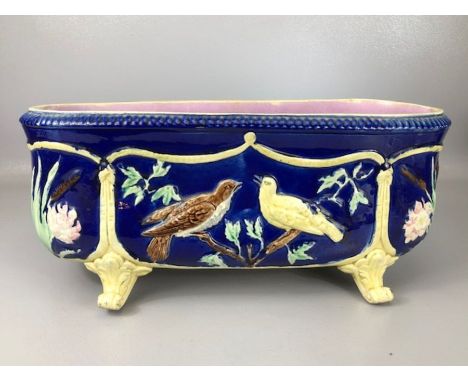 Victorian majolica oblong planter with bird design on a blue background and pink interior glaze, approx 44cm in length