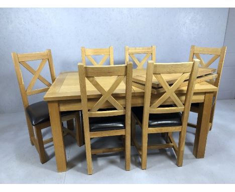 Modern oak extending dining room table with five chairs, table approx 220cm x 90cm fully extended