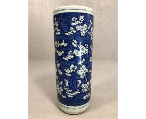 Chinese ceramic blue and white umbrella stand depicting blossoms, approx 22cm x 59cm