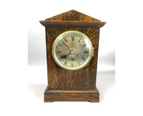 RAF Officers Mess mantel clock by F.W. Elliott Ltd, 1939, the triangular topped oak case with silvered Roman dial and fusee m