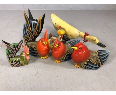 Collection of decorative wooden and ceramic cockerels and a duck
