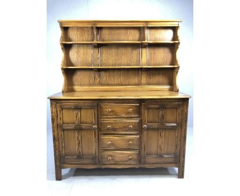 Ercol 'Golden Dawn' elm dresser with shelves over, four drawers and two cupboards under, approx 145cm x 50cm x 170cm tall