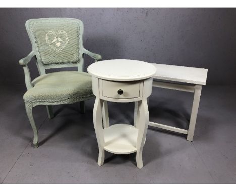 Three items of furniture: a pale green occasional bedroom chair, a circular bedside with single drawer and a white painted oc