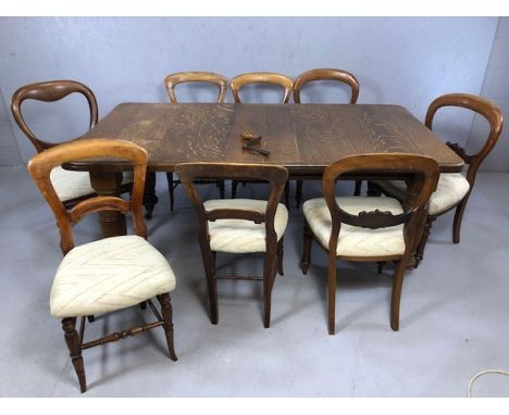 Victorian oak extending dining table on heavily carved legs and original castors with three additional leaves (each approx 32