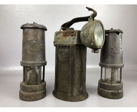 Three vintage lamps to include an Oldham Wheat Electric lamp by Oldham &amp; Son Ltd, a Lamp and Limelight miner's lamp with 