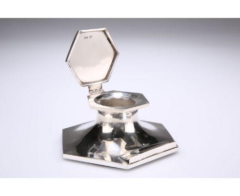 A GEORGE V SILVER INKWELL,&nbsp;by Walker &amp; Hall, Sheffield 1922, hexagonal with conforming hinged cover and pen rest, we