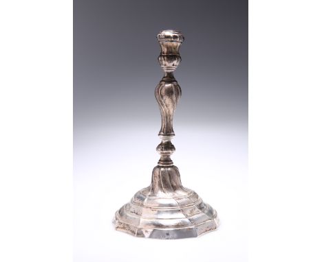 A CONTINENTAL CAST SILVER CANDLESTICK, possibly Dutch, 18th Century, with domed ogee base and wrythen baluster stem, markes t