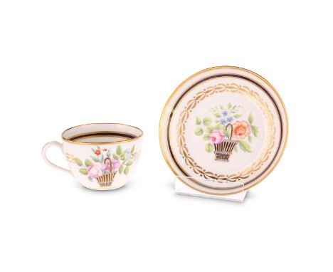 A NEW HALL CUP AND SAUCER, CIRCA 1800Decorated to pattern number 611 with a blue and gold basket and finely painted flowers.S