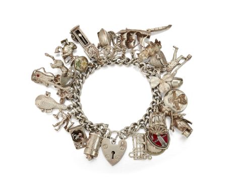 A SILVER CHARM BRACELET, the bracelet hallmarked&nbsp;London 1977, charms include longcase clock, guitar, owl, Mickey Mouse, 