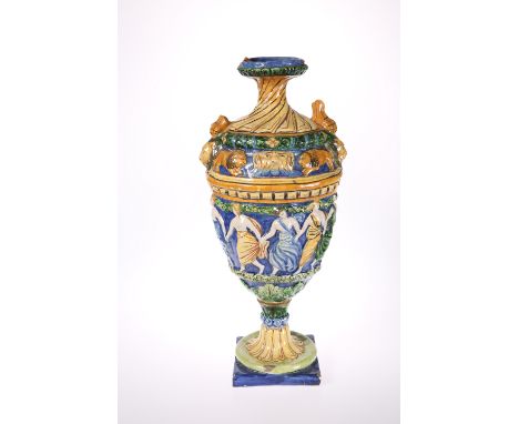 A LARGE MAIOLICA VASE, of urn form, moulded with dancing maidens and lions, (a/f). 52cm high