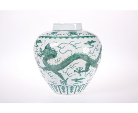 A CHINESE DRAGON VASE, of shouldered ovoid form, green painted with dragons and flaming pearls, bears blue seal type mark. 21
