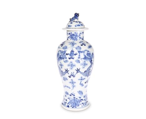 A CHINESE BLUE AND WHITE PORCELAIN&nbsp;VASE AND COVER, 19TH CENTURY, of baluster form with domed cover, painted with dragons