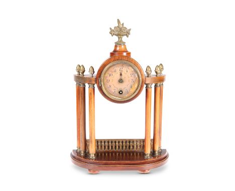 A CONTINENTAL WALNUT AND GILT-BRASS MOUNTED PORTICO CLOCK, CIRCA 1900, the drum case with finial in the form of a vase of flo