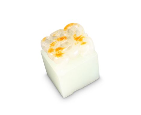 THREE CHINESE JADE SEALS, the first rectangular and carved with pierced foliage, the second rectangular with rounded ends and