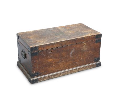 A 19TH CENTURY IRON-BOUND OAK TRUNK, with twin locks (one lacking) and carrying handles. 44.5cm high, 91cm long, 45cm deep