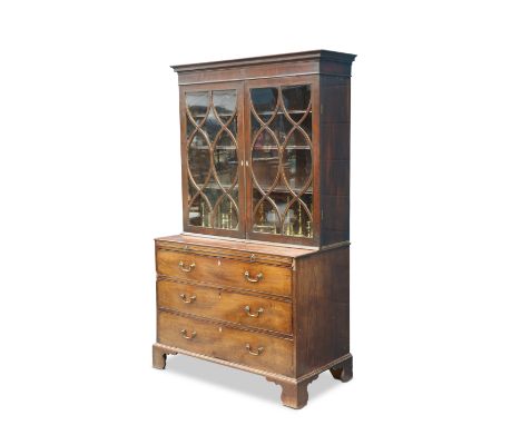 A GEORGE III MAHOGANY BOOKCASE ON CHEST, the upper section with scrolling glazing bars to form ovals and lozenges, the chest 