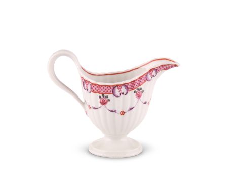 A NEW HALL CORRUGATED CREAM JUGOf pedestal form, painted to pattern number 78 with pink hatching and purple C-scrolls above s