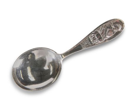 A GEORGE V SILVER CADDY SPOON,&nbsp;by&nbsp;W H Collins &amp; Co, Birmingham 1935, decorated with a young girl and sheep, tit