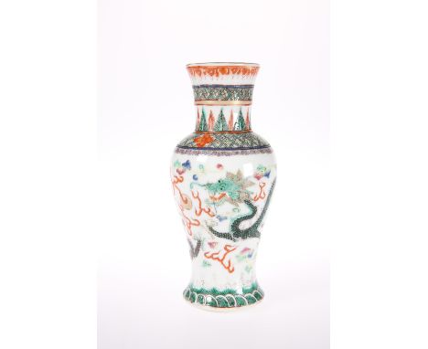 A CHINESE FAMILLE VERTE DRAGON VASEOf baluster form, enamel painted with two dragons chasing the flaming pearl, bears iron re