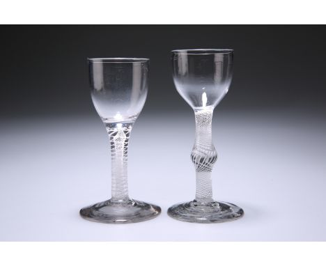 TWO OPAQUE TWIST CORDIAL GLASSESCirca 1760The first with double twist stem, the second with a single series twist, each with 