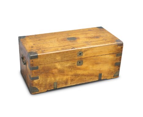 A 19TH CENTURY BRASS-BOUND CAMPHOR WOOD TRUNK, with carrying handles. 77cm long