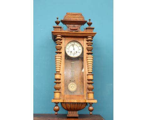 A 19TH CENTURY WALNUT VIENNA PATTERN WALL CLOCK, the enamel dial with Roman numerals, the two-train movement striking the hou
